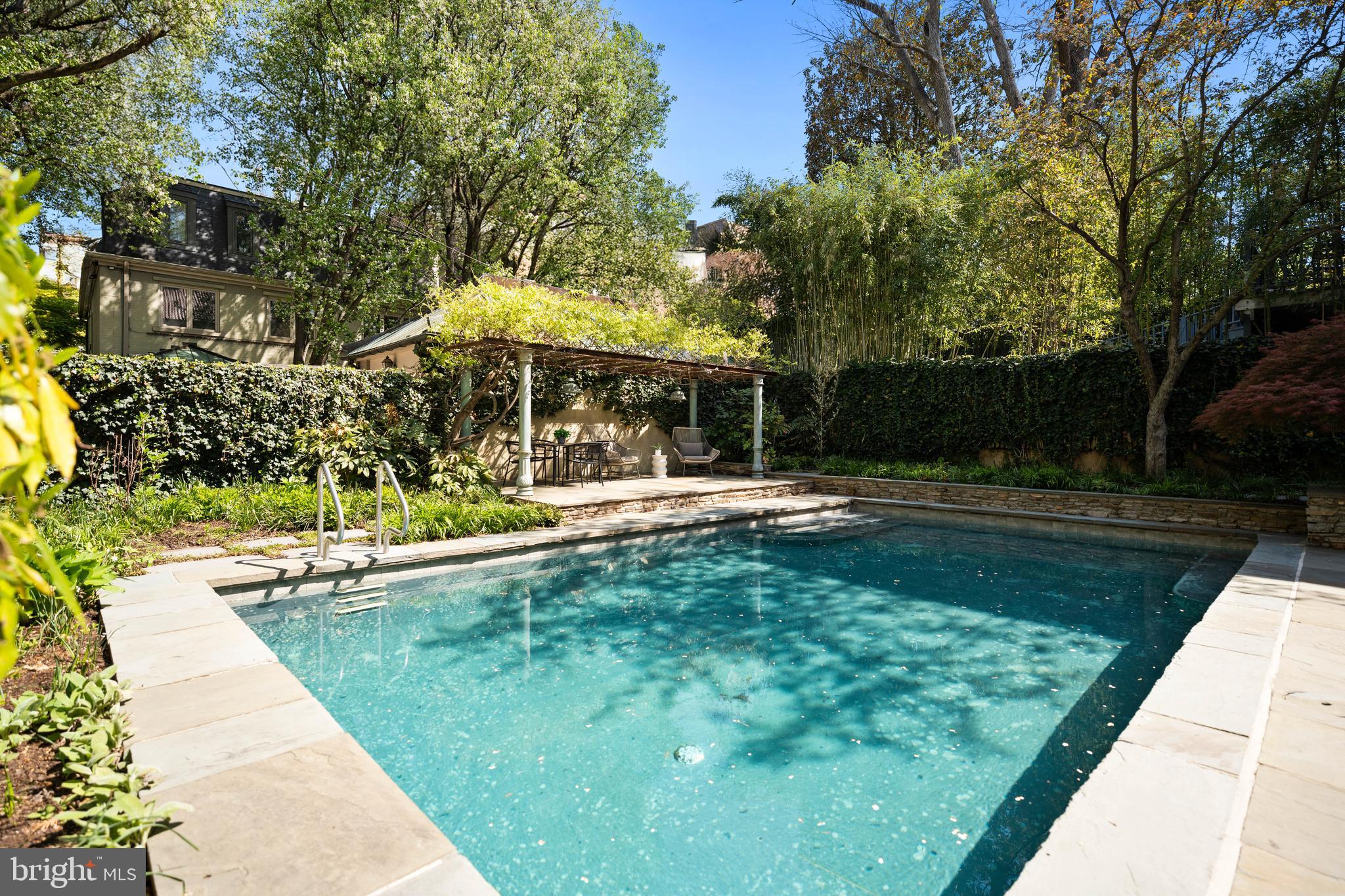 2319 Bancroft Place Northwest Washington, DC 20008 - Photo 35 of 37 a view of a swimming pool with a patio