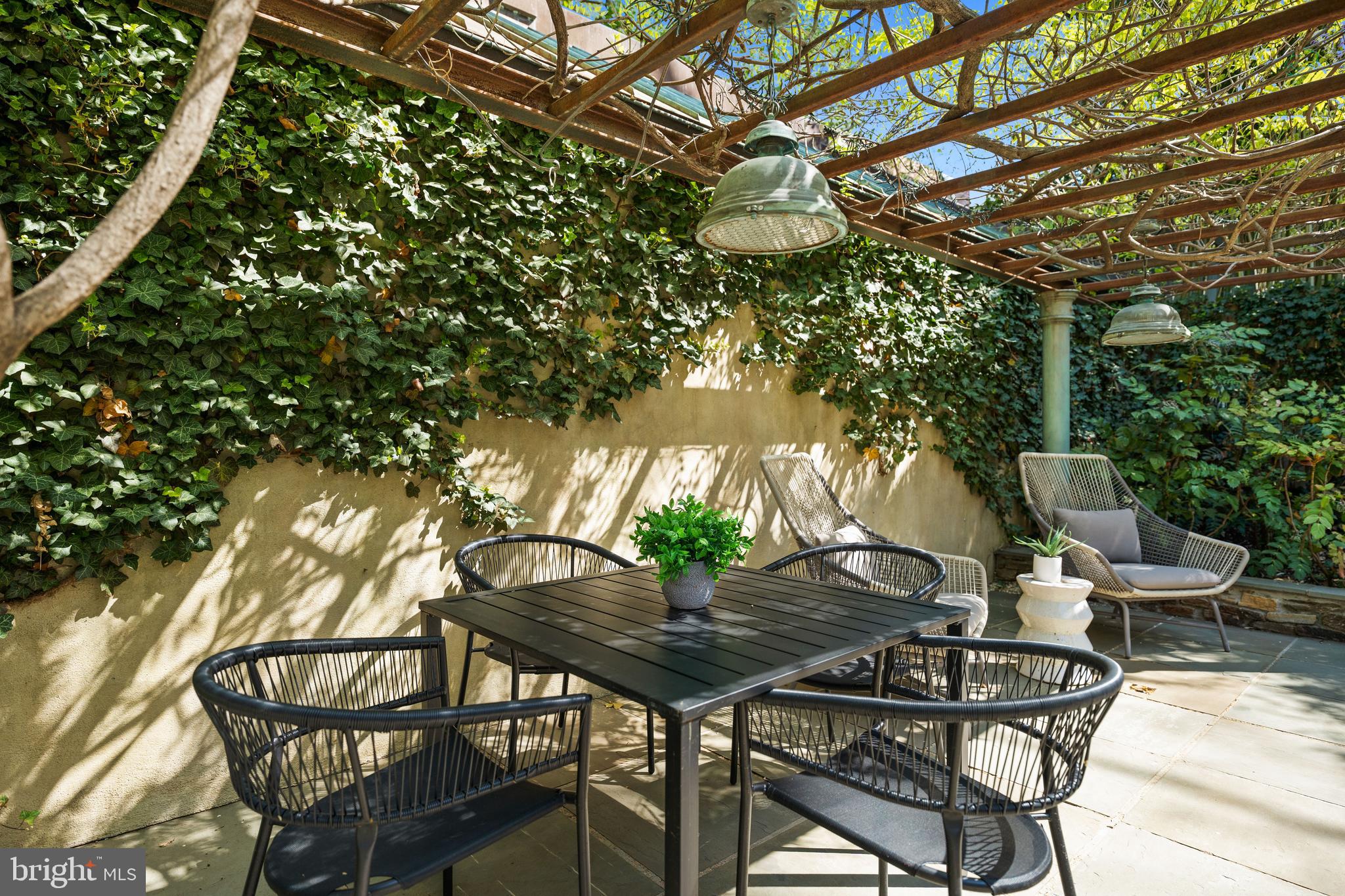 2319 Bancroft Place Northwest Washington, DC 20008 - Photo 36 of 37 a view of a chairs and table in backyard