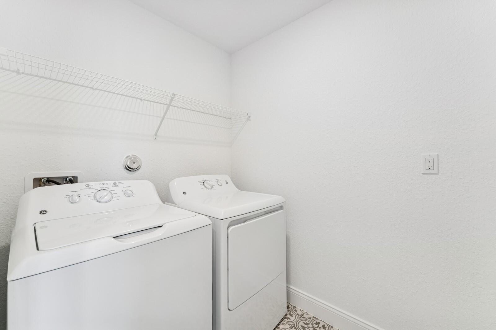 188 Southeast Birch Terrace, Unit 313 Stuart, FL 34997 - Photo 13 of 30 a utility room with dryer and washer