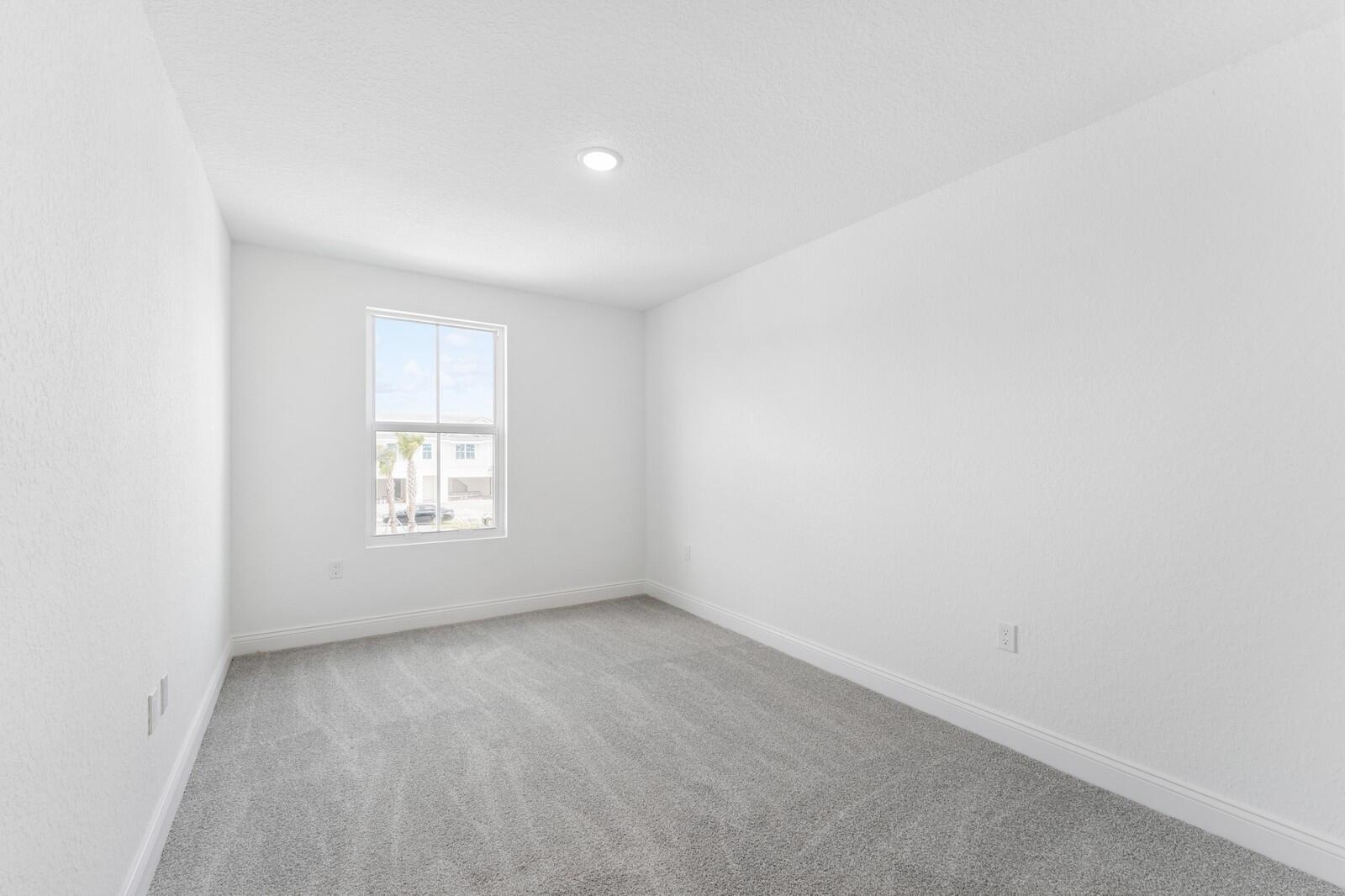 188 Southeast Birch Terrace, Unit 313 Stuart, FL 34997 - Photo 18 of 30 a view of an empty room with a window