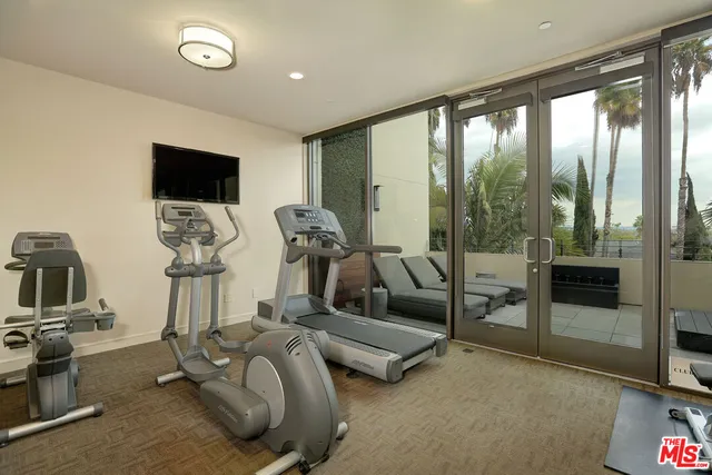 a view of swimming pool with outdoor seating and plants