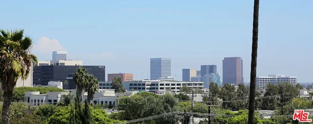 a view of a city with tall buildings in the background
