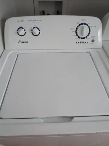a bathroom with a washer and dryer