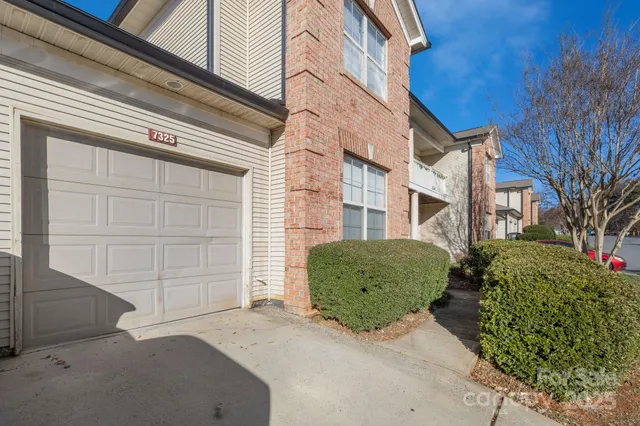 a view of a street with a house