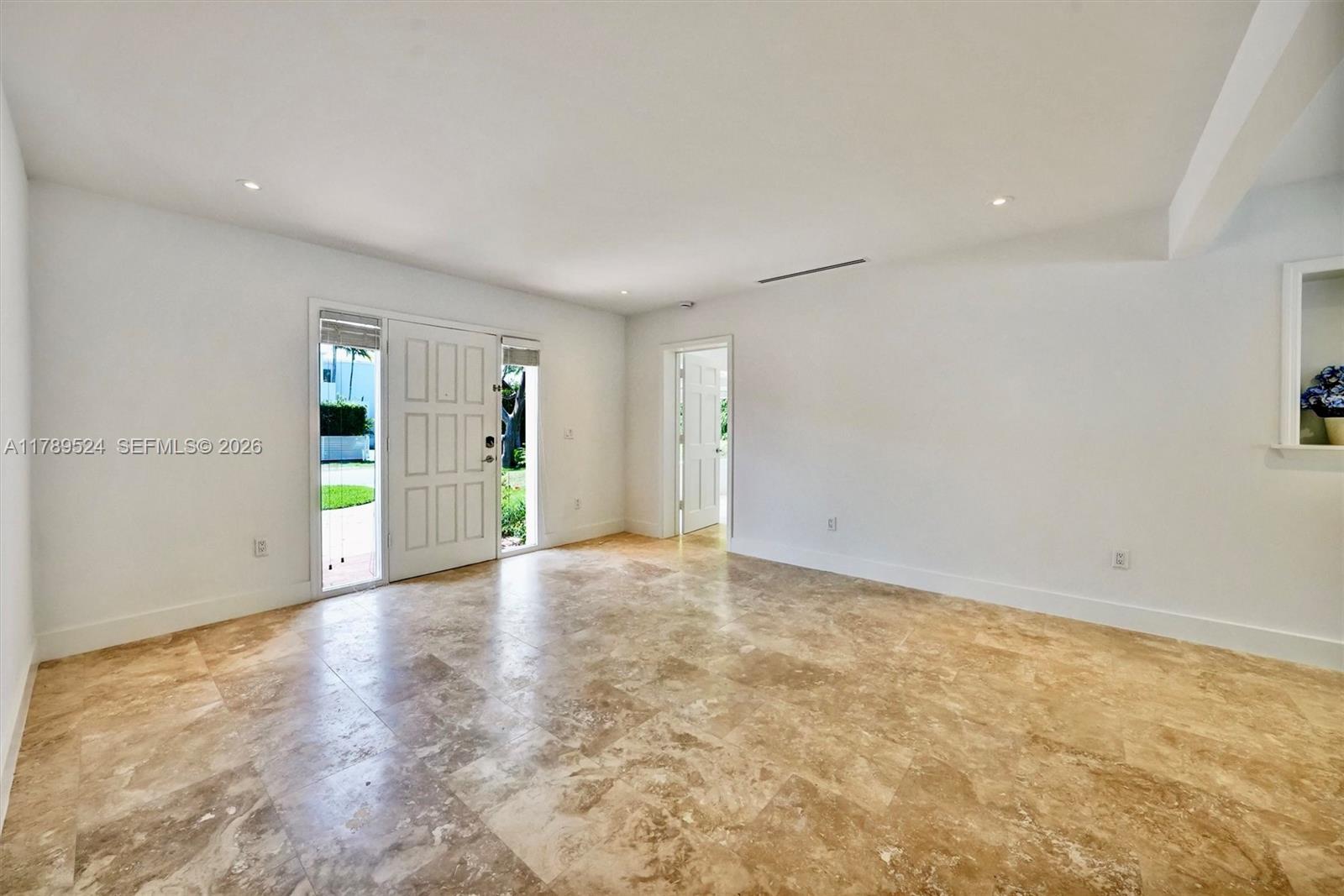 255 Ridgewood Road Key Biscayne, FL 33149 - Photo 13 of 61 a view of an empty room with window and bathroom