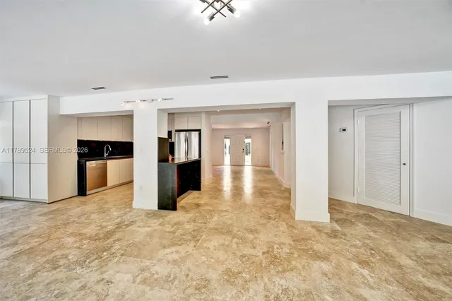 a view of an empty room with a window