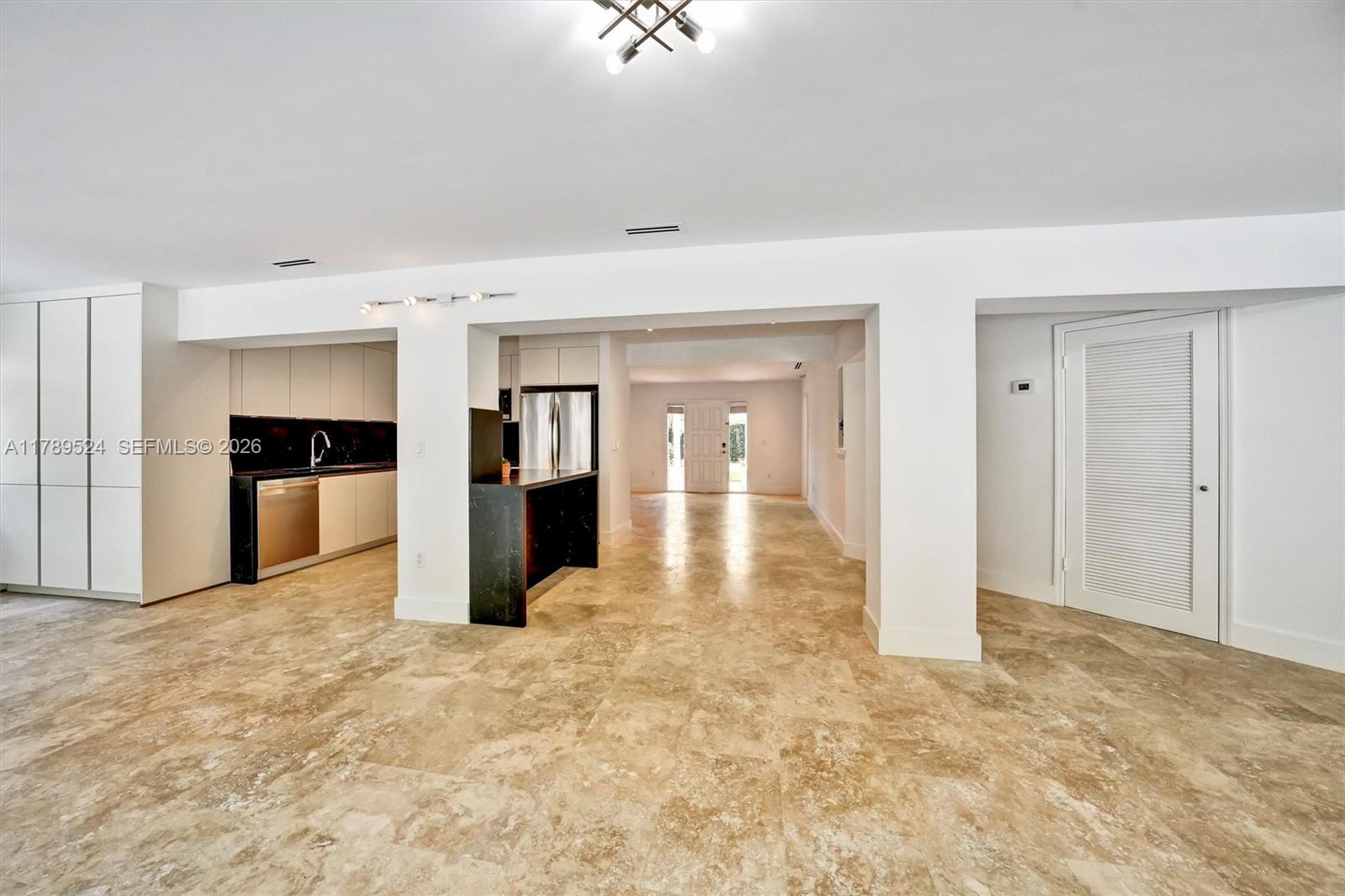 255 Ridgewood Road Key Biscayne, FL 33149 - Photo 17 of 61 a view of a kitchen with refrigerator and a sink