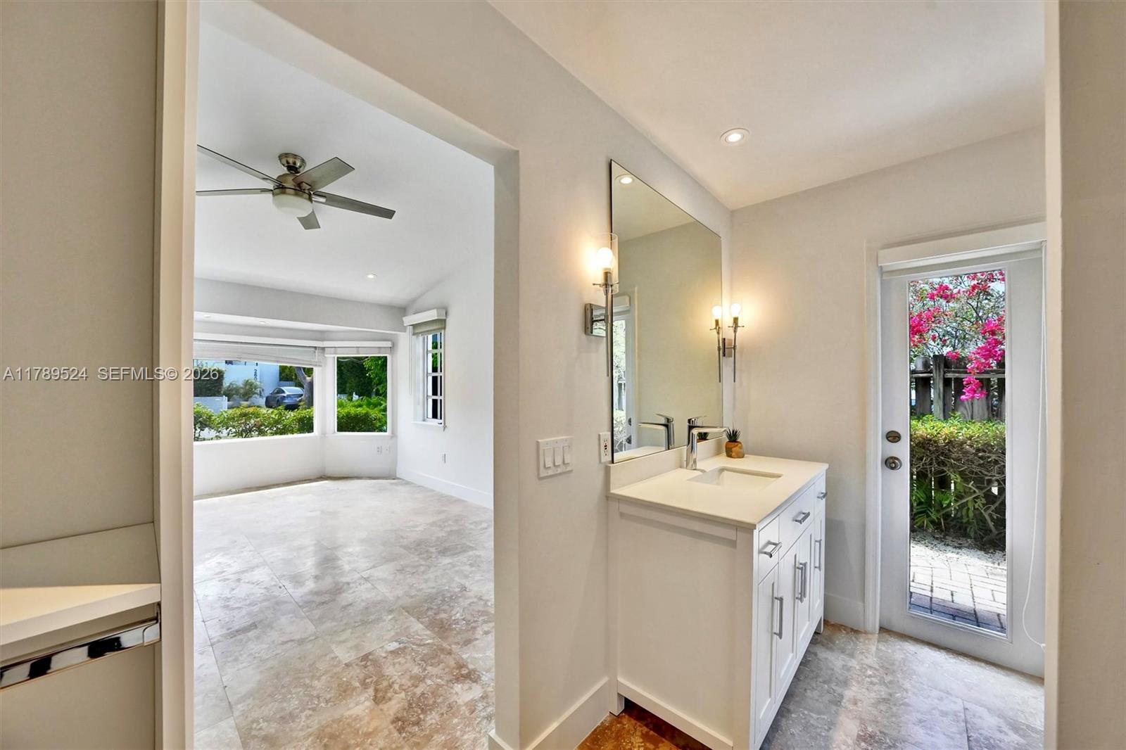 255 Ridgewood Road Key Biscayne, FL 33149 - Photo 26 of 61 a bathroom with a sink vanity and mirror