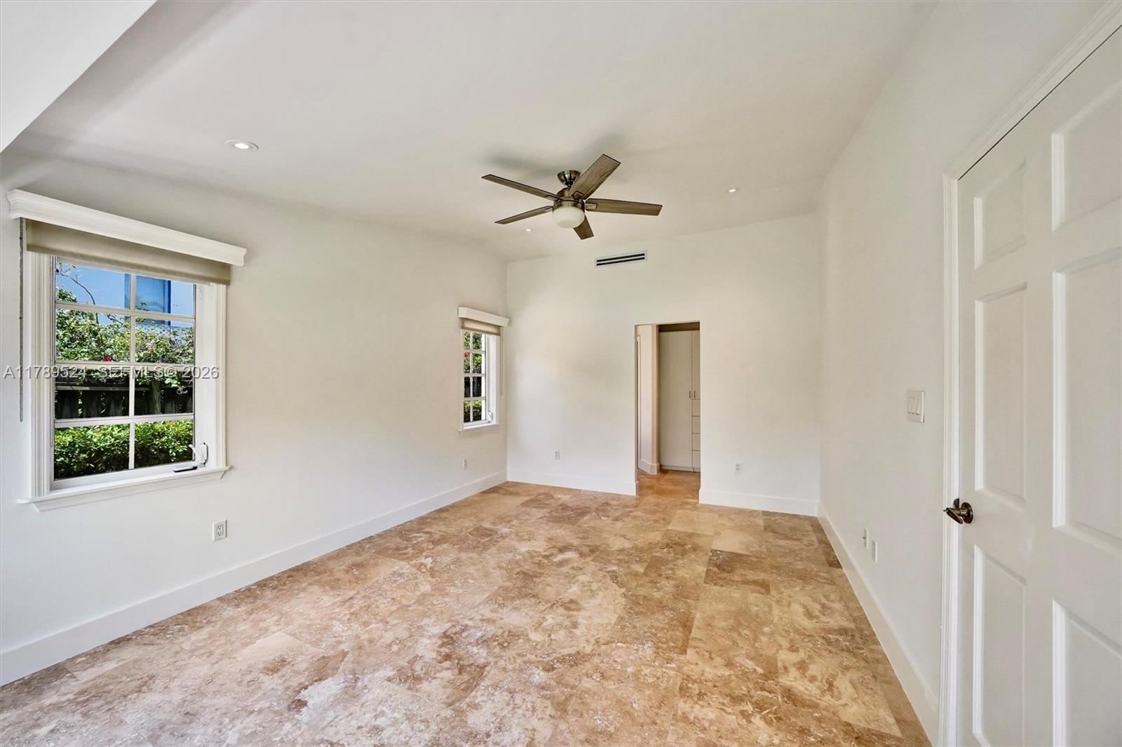 255 Ridgewood Road Key Biscayne, FL 33149 - Photo 39 of 61 a view of a livingroom with a ceiling fan and window