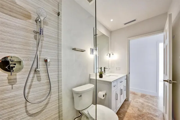 a kitchen with a refrigerator and a sink
