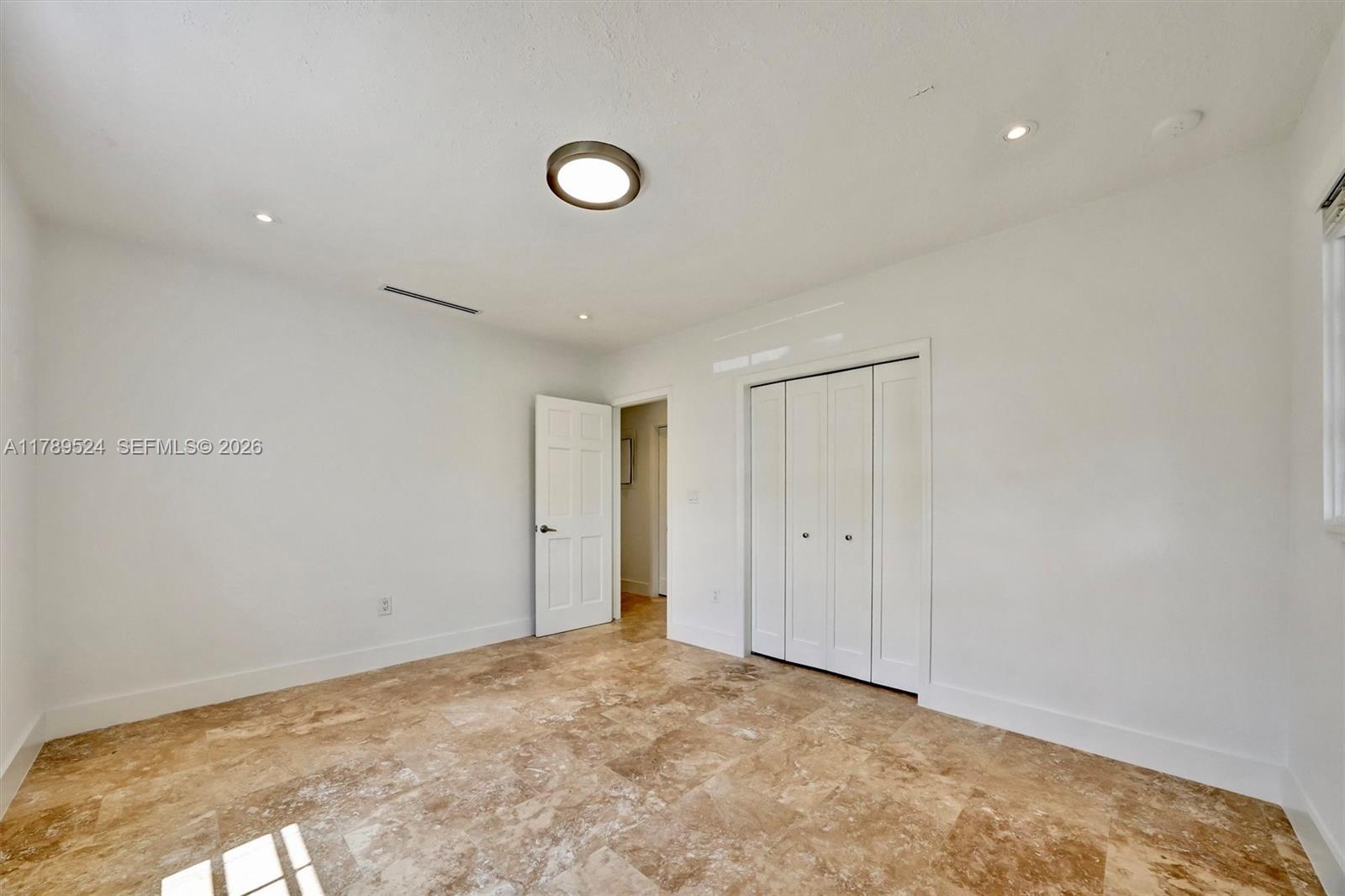 255 Ridgewood Road Key Biscayne, FL 33149 - Photo 40 of 61 a view of an empty room