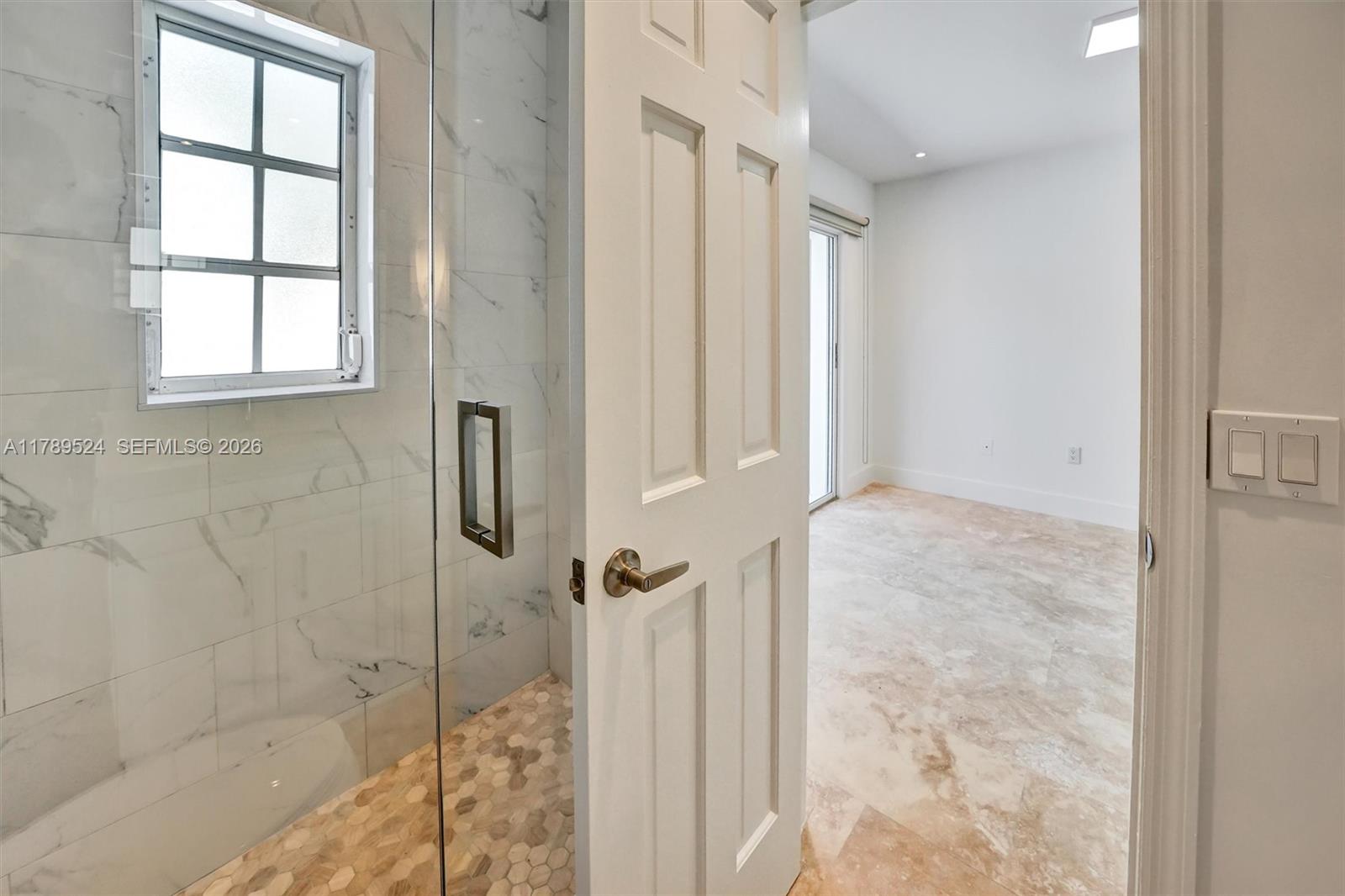 255 Ridgewood Road Key Biscayne, FL 33149 - Photo 45 of 61 a bathroom with a shower
