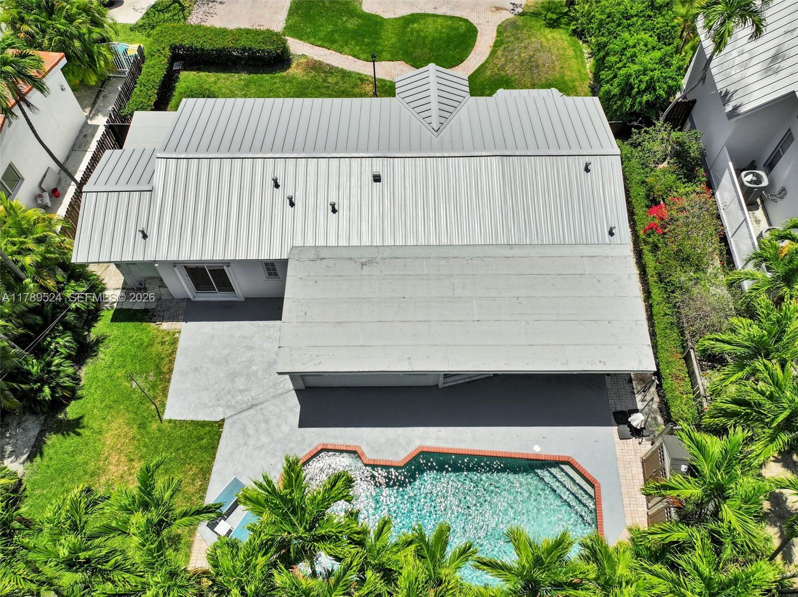 255 Ridgewood Road Key Biscayne, FL 33149 - Photo 52 of 61 a view of a back yard of the house
