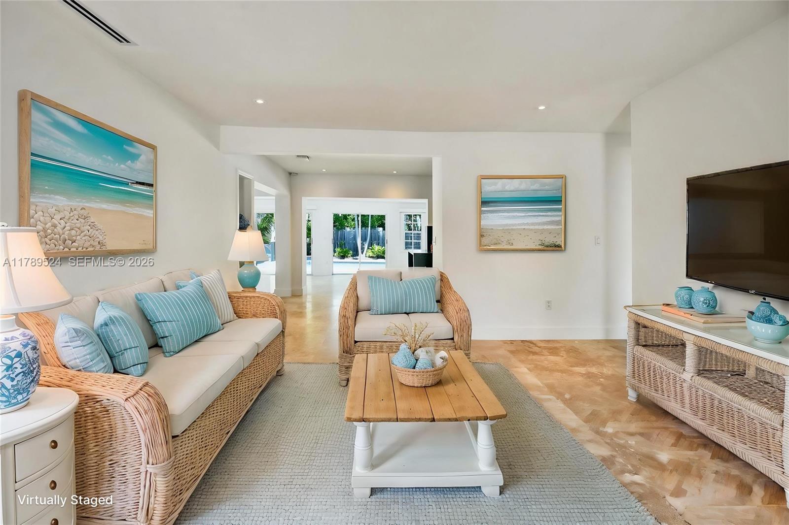 255 Ridgewood Road Key Biscayne, FL 33149 - Photo 10 of 61 a living room with furniture and a flat screen tv