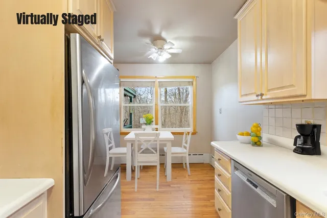 a view of a dining room with furniture window and outside view