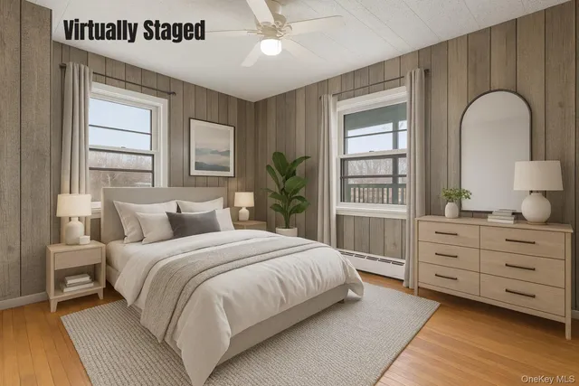 a bedroom with a large bed and window