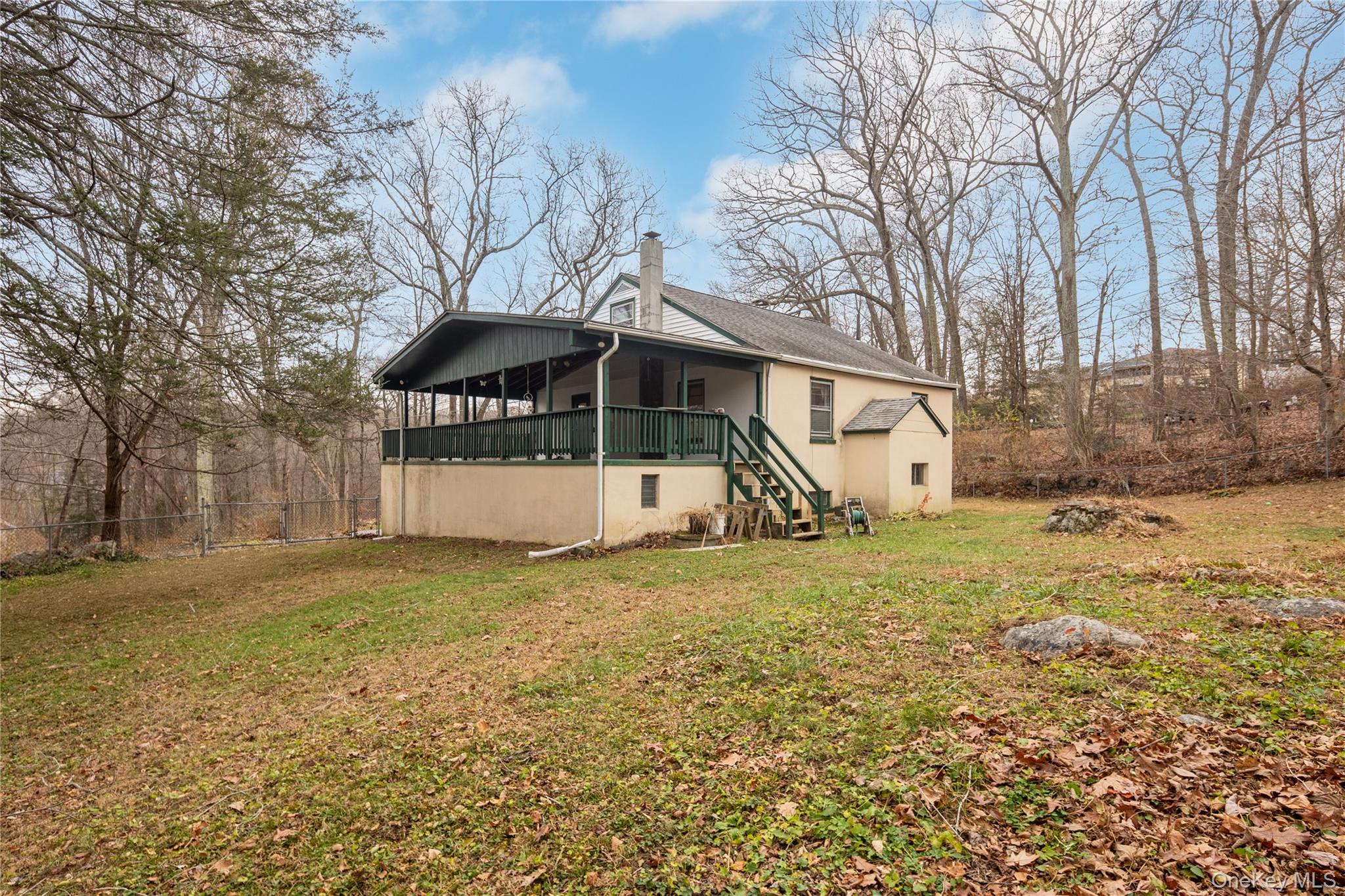 7 Venice Road Patterson, NY 12563 - Photo 28 of 35 a view of a house with a yard covered with snow and trees