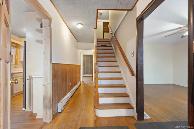 a view of entryway with wooden floor