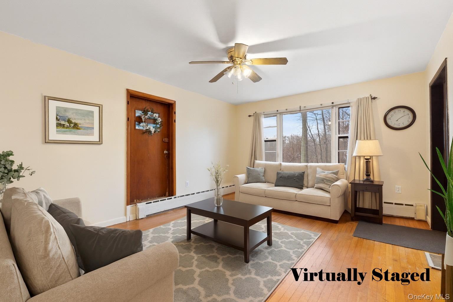 7 Venice Road Patterson, NY 12563 - Photo 7 of 35 a living room with furniture and a large window