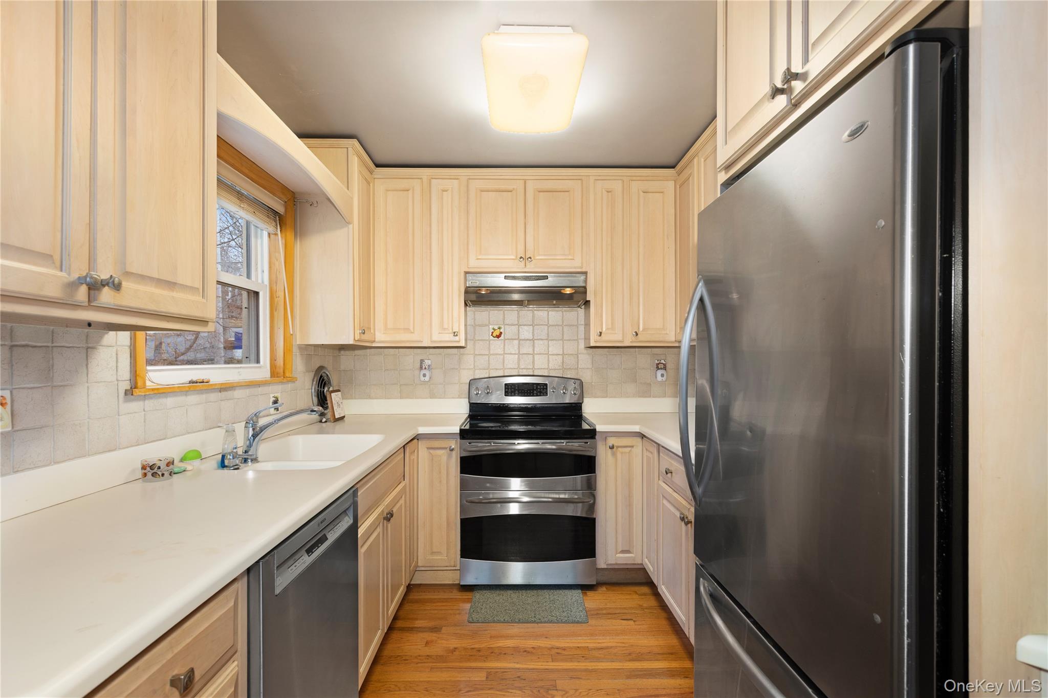 7 Venice Road Patterson, NY 12563 - Photo 10 of 35 a kitchen with a sink stove and refrigerator
