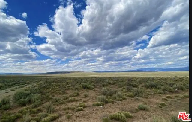 a view of an outdoor space with mountain view and mountains in the background