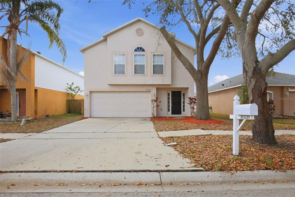 11331 Ivy Flower Loop Riverview, FL 33578 - Photo 1 of 36 a front view of a house with garden