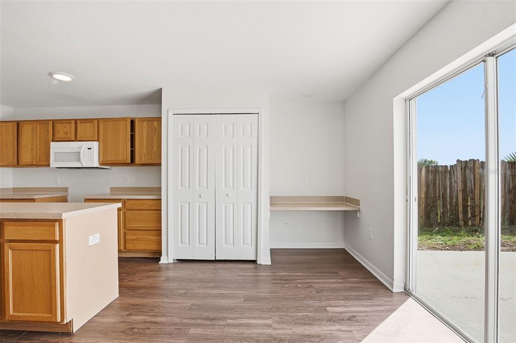 11331 Ivy Flower Loop Riverview, FL 33578 - Photo 11 of 36 a view of a kitchen with a sink and a fireplace