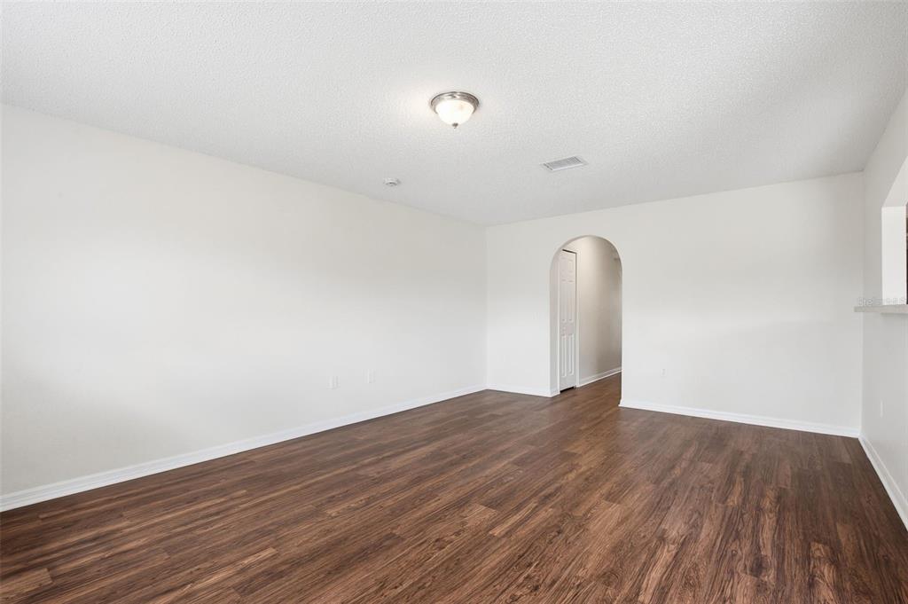 11331 Ivy Flower Loop Riverview, FL 33578 - Photo 13 of 36 a view of a room with wooden floor and window