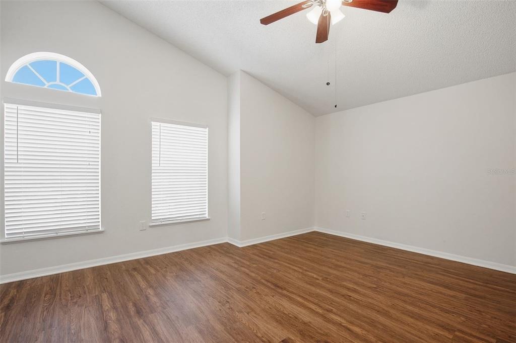11331 Ivy Flower Loop Riverview, FL 33578 - Photo 14 of 36 wooden floor in an empty room with a window