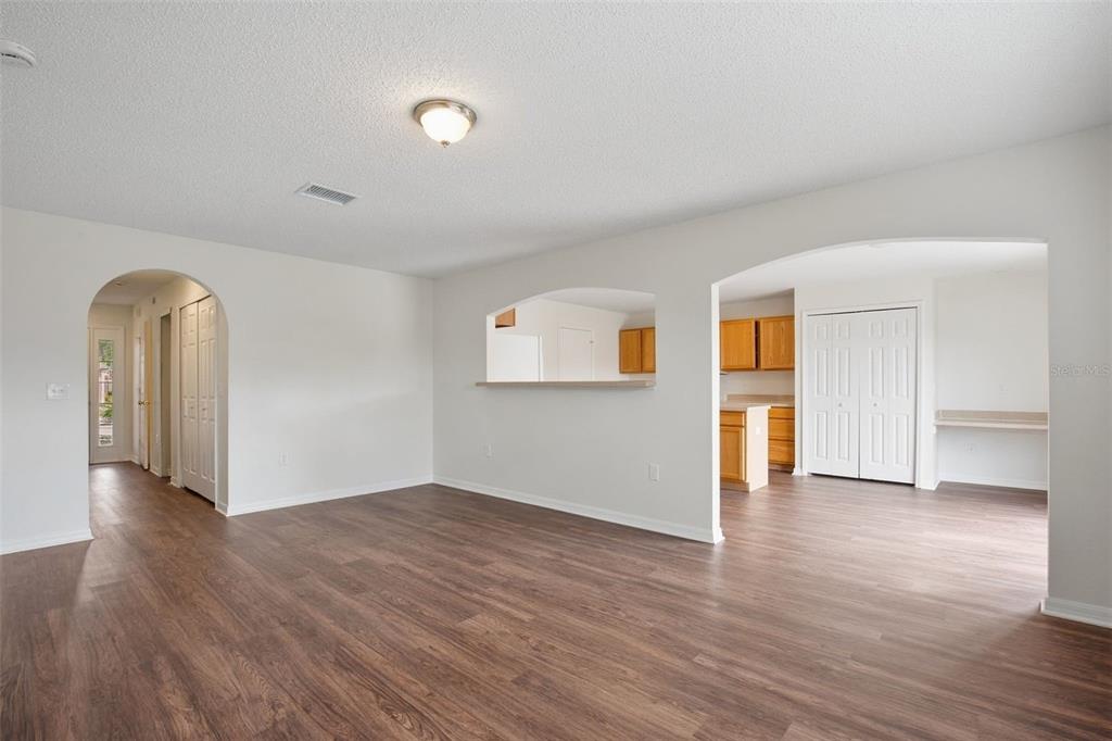 11331 Ivy Flower Loop Riverview, FL 33578 - Photo 2 of 36 a view of empty room with wooden floor