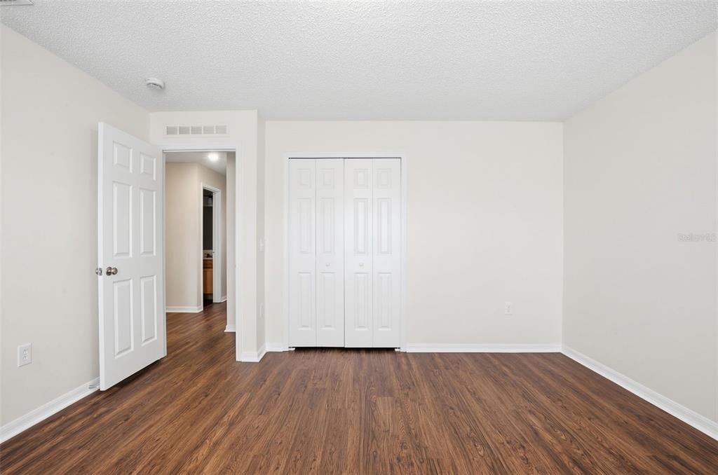 11331 Ivy Flower Loop Riverview, FL 33578 - Photo 23 of 36 an empty room with wooden floor