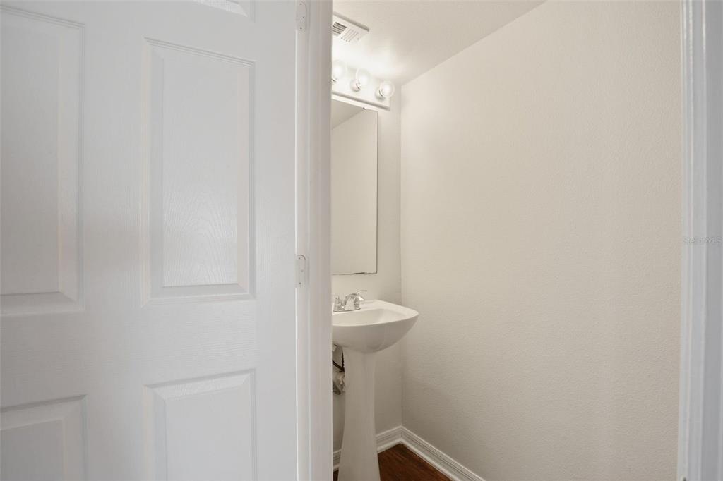 11331 Ivy Flower Loop Riverview, FL 33578 - Photo 28 of 36 a bathroom with a sink a mirror and shower