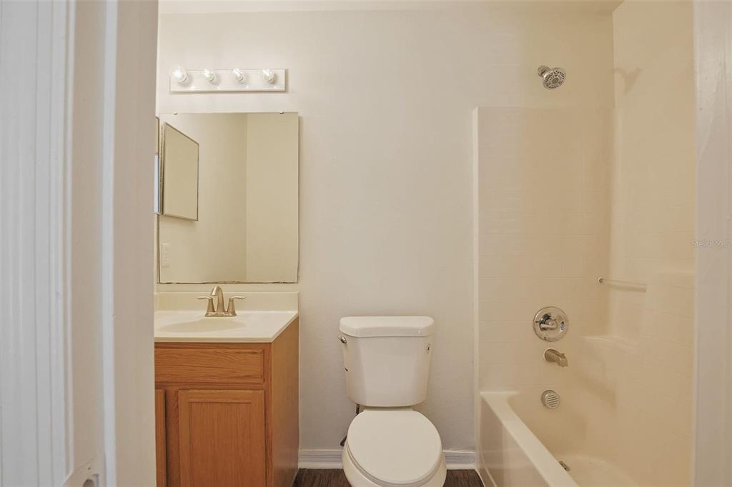 11331 Ivy Flower Loop Riverview, FL 33578 - Photo 30 of 36 a bathroom with a sink a toilet and shower