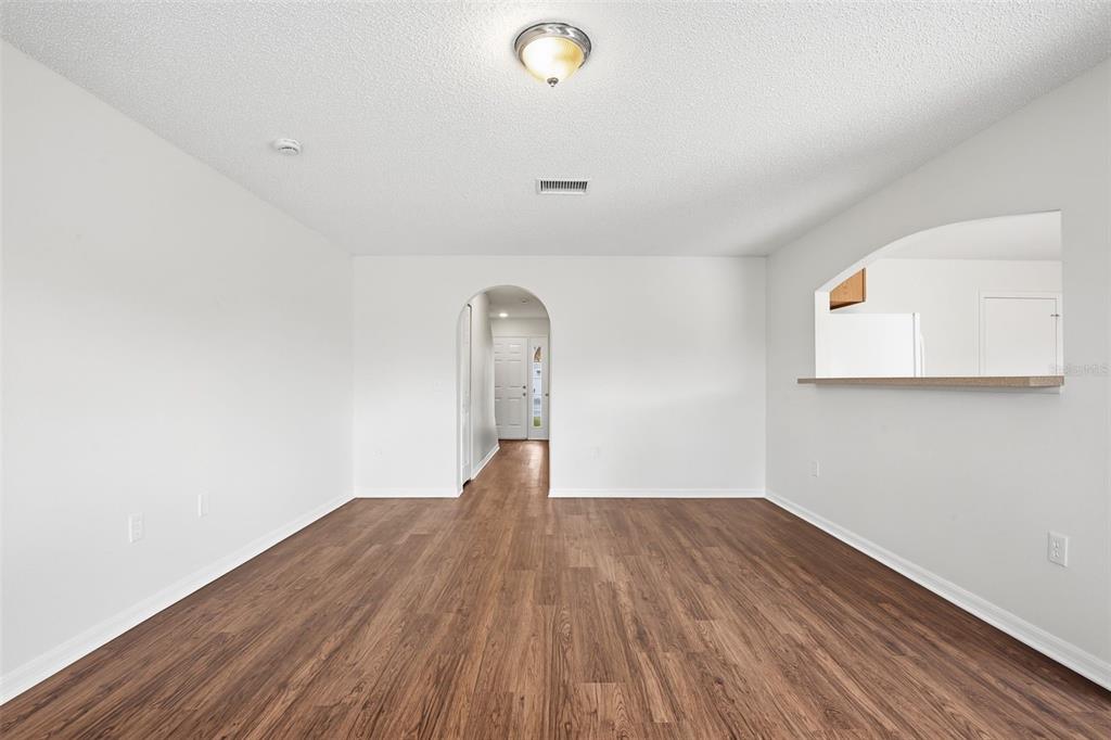 11331 Ivy Flower Loop Riverview, FL 33578 - Photo 3 of 36 a view of empty room with wooden floor
