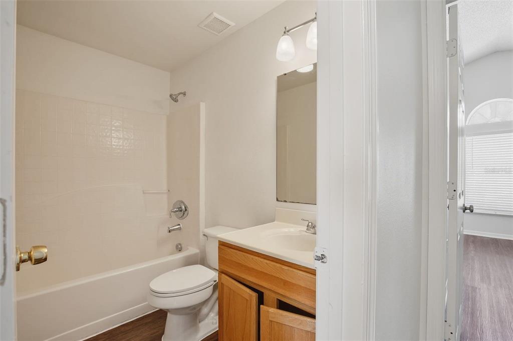 11331 Ivy Flower Loop Riverview, FL 33578 - Photo 31 of 36 a bathroom with a sink toilet vanity and shower