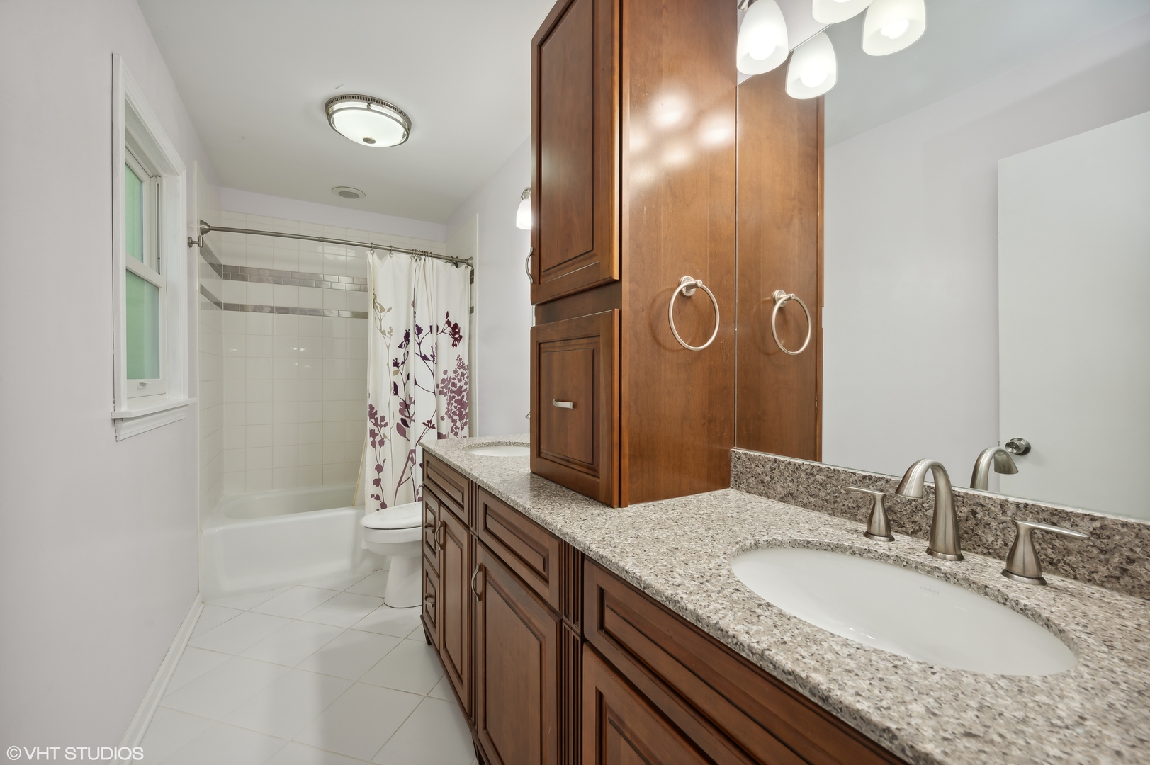 2224 Maple Avenue Northbrook, IL 60062 - Photo 11 of 25 a bathroom with a granite countertop double vanity and a mirror