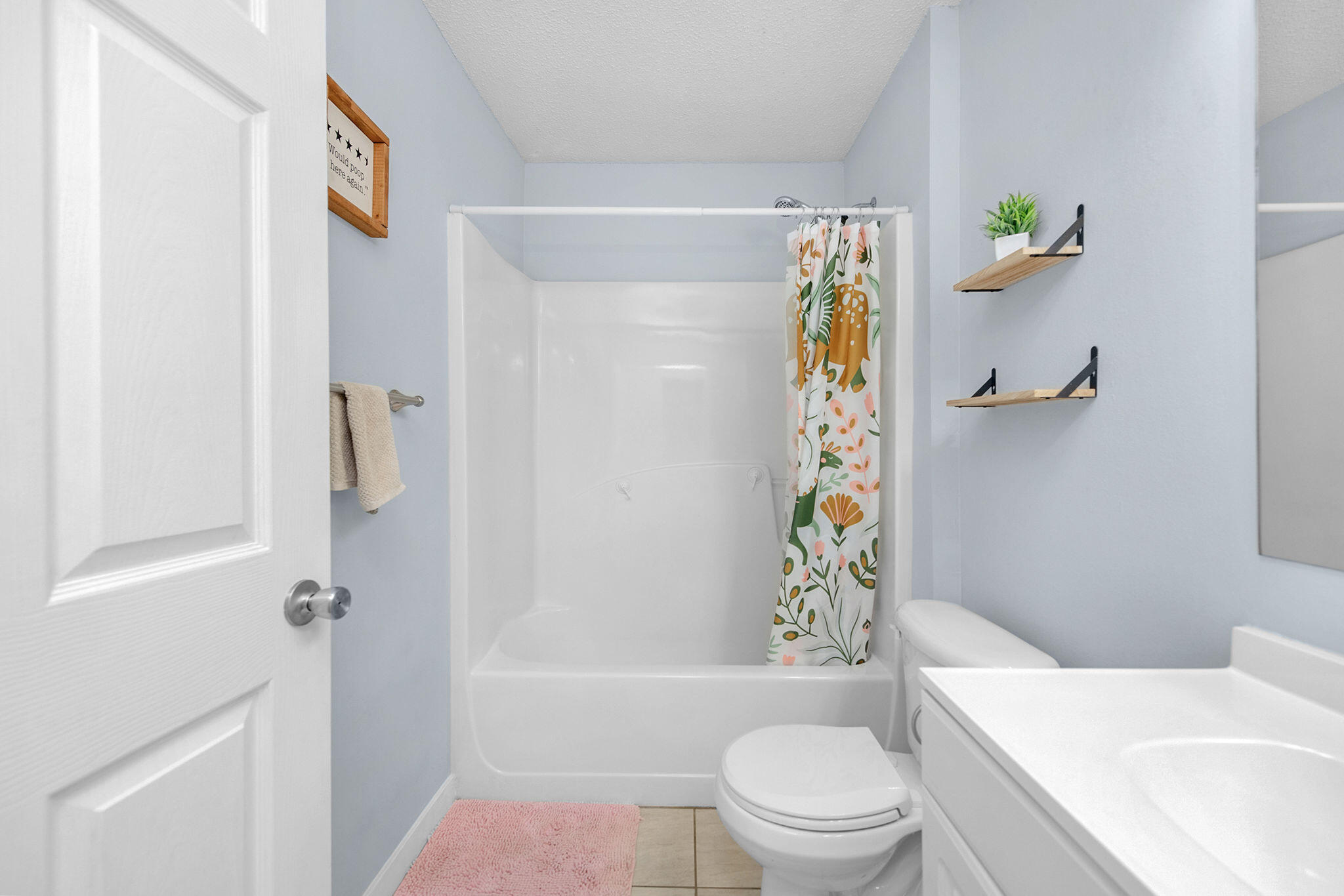 404 Bobby Drive Crestview, FL 32536 - Photo 12 of 30 a bathroom with a toilet a sink and bathtub