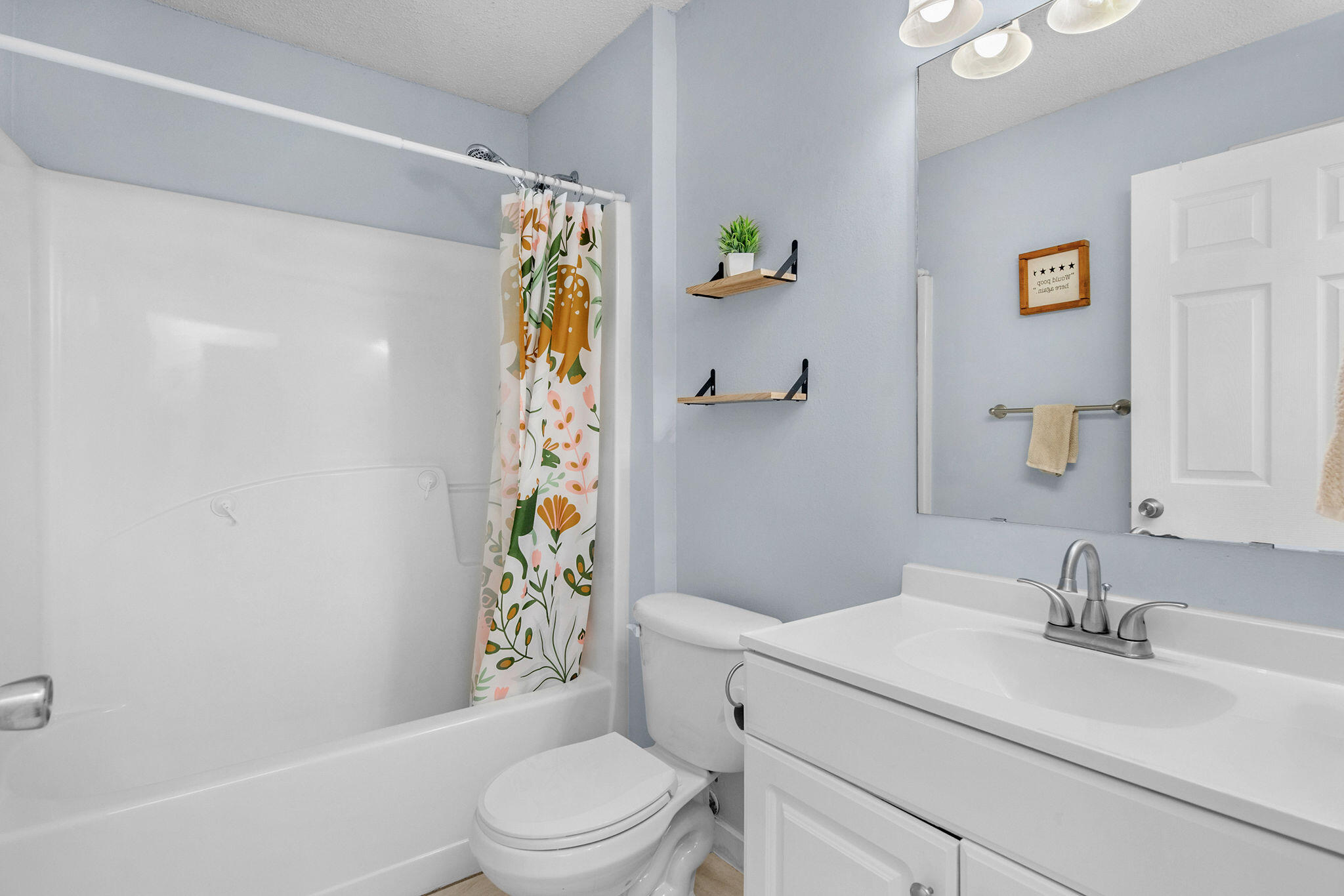 404 Bobby Drive Crestview, FL 32536 - Photo 13 of 30 a bathroom with a sink toilet and shower