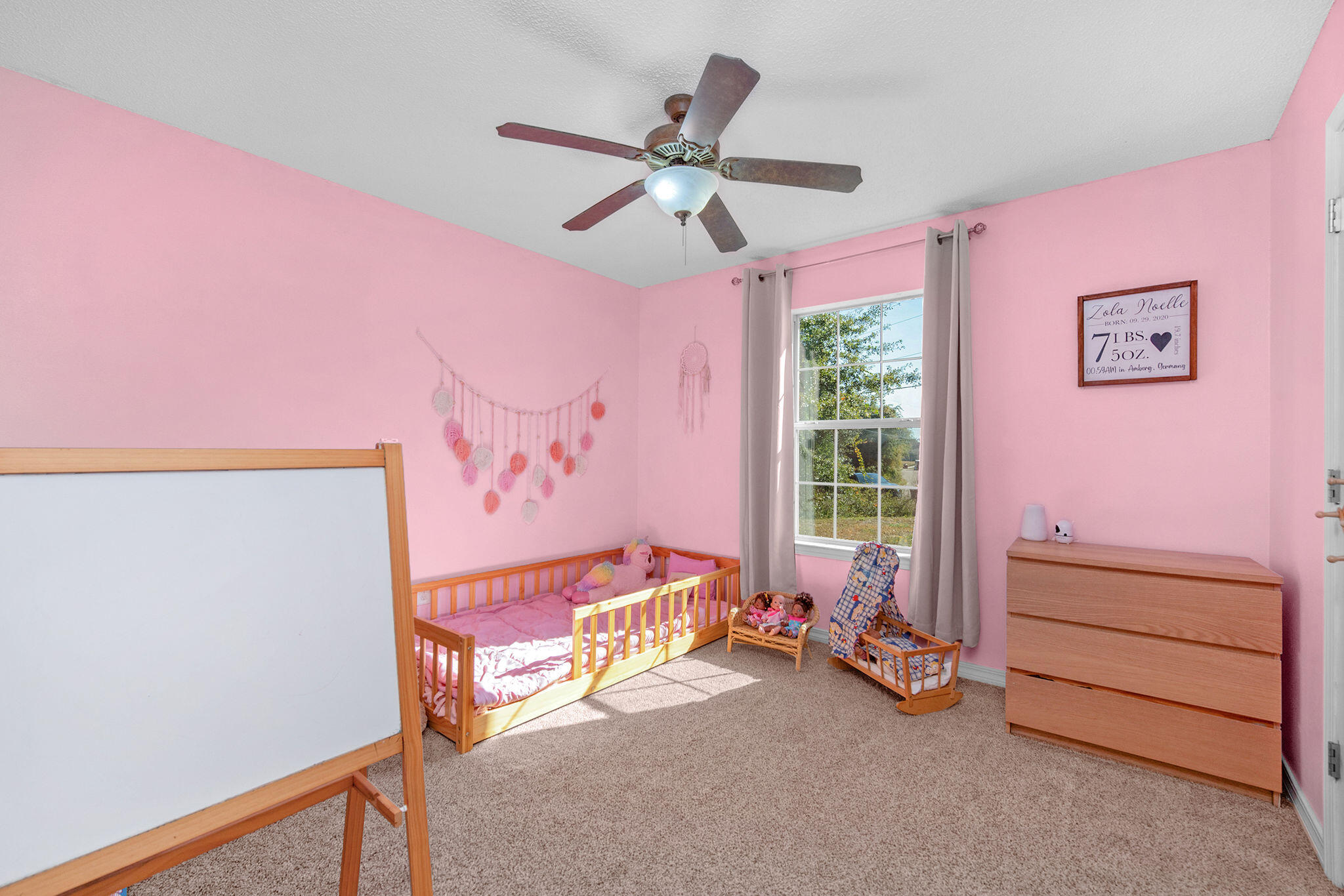 404 Bobby Drive Crestview, FL 32536 - Photo 14 of 30 a bed room with a bed and a window