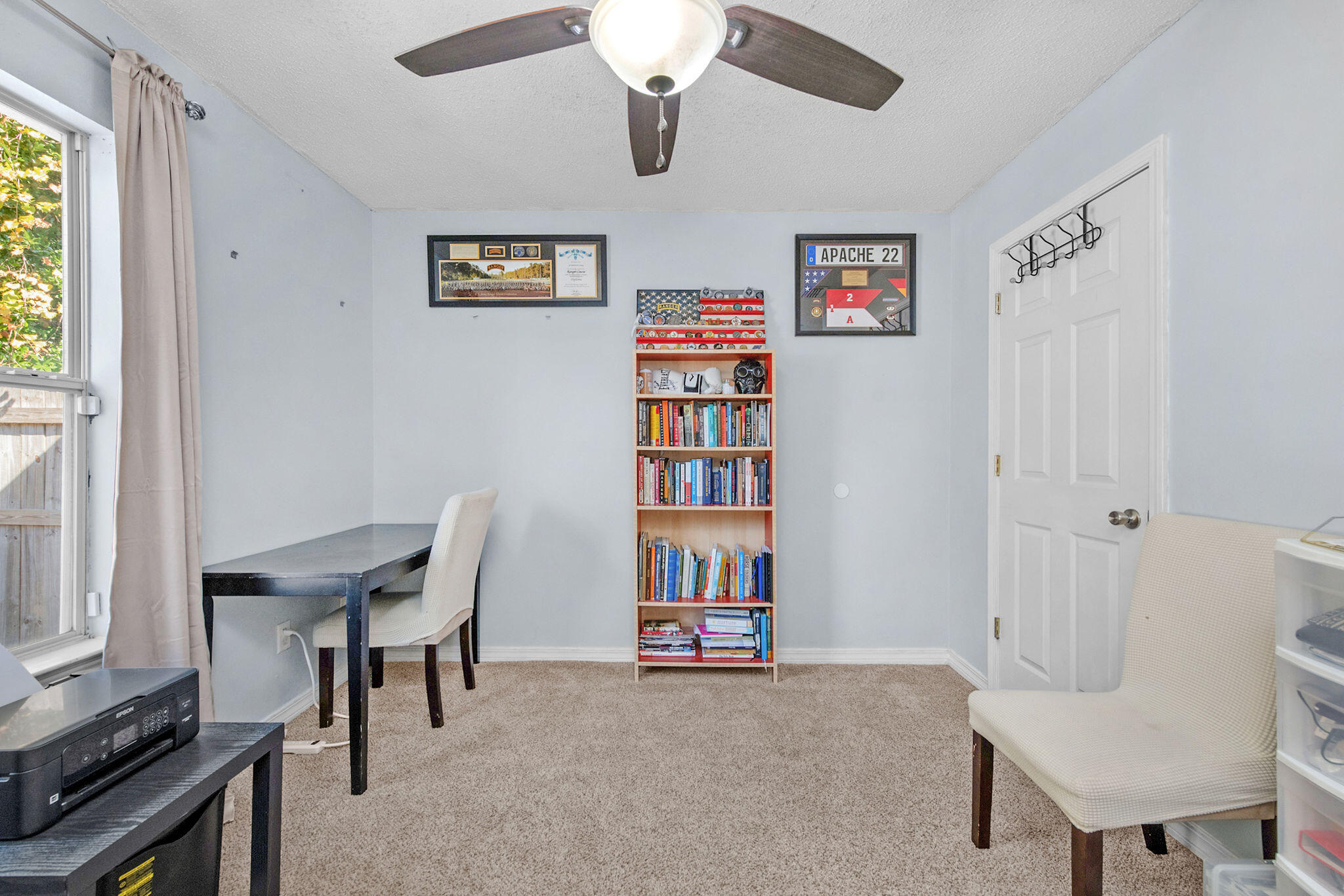 404 Bobby Drive Crestview, FL 32536 - Photo 18 of 30 a view of a workspace with furniture and a window