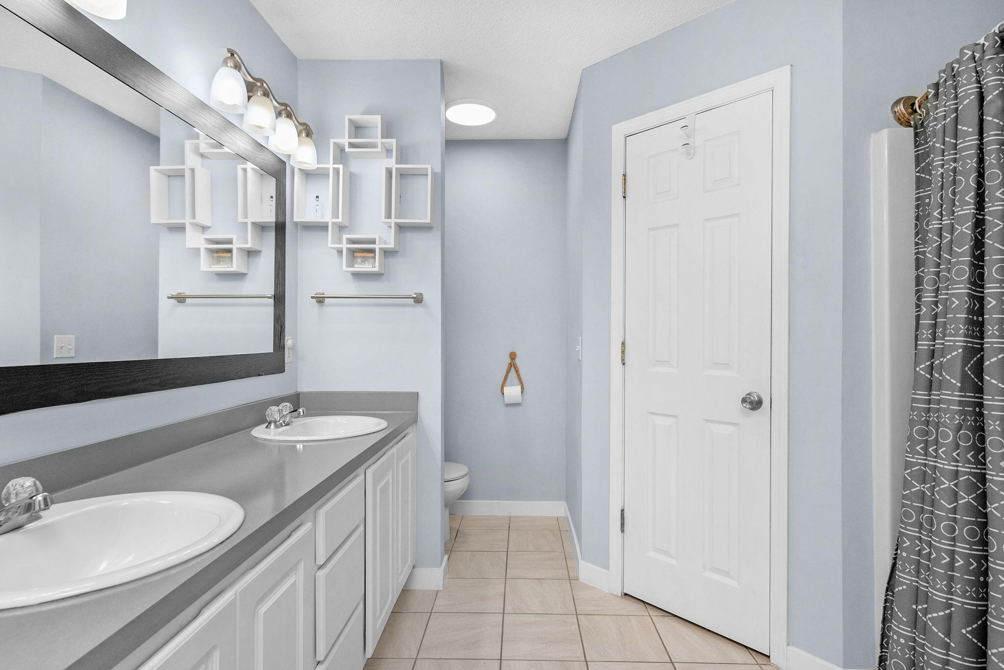 404 Bobby Drive Crestview, FL 32536 - Photo 25 of 30 a spacious bathroom with a granite countertop sink a mirror and a shower