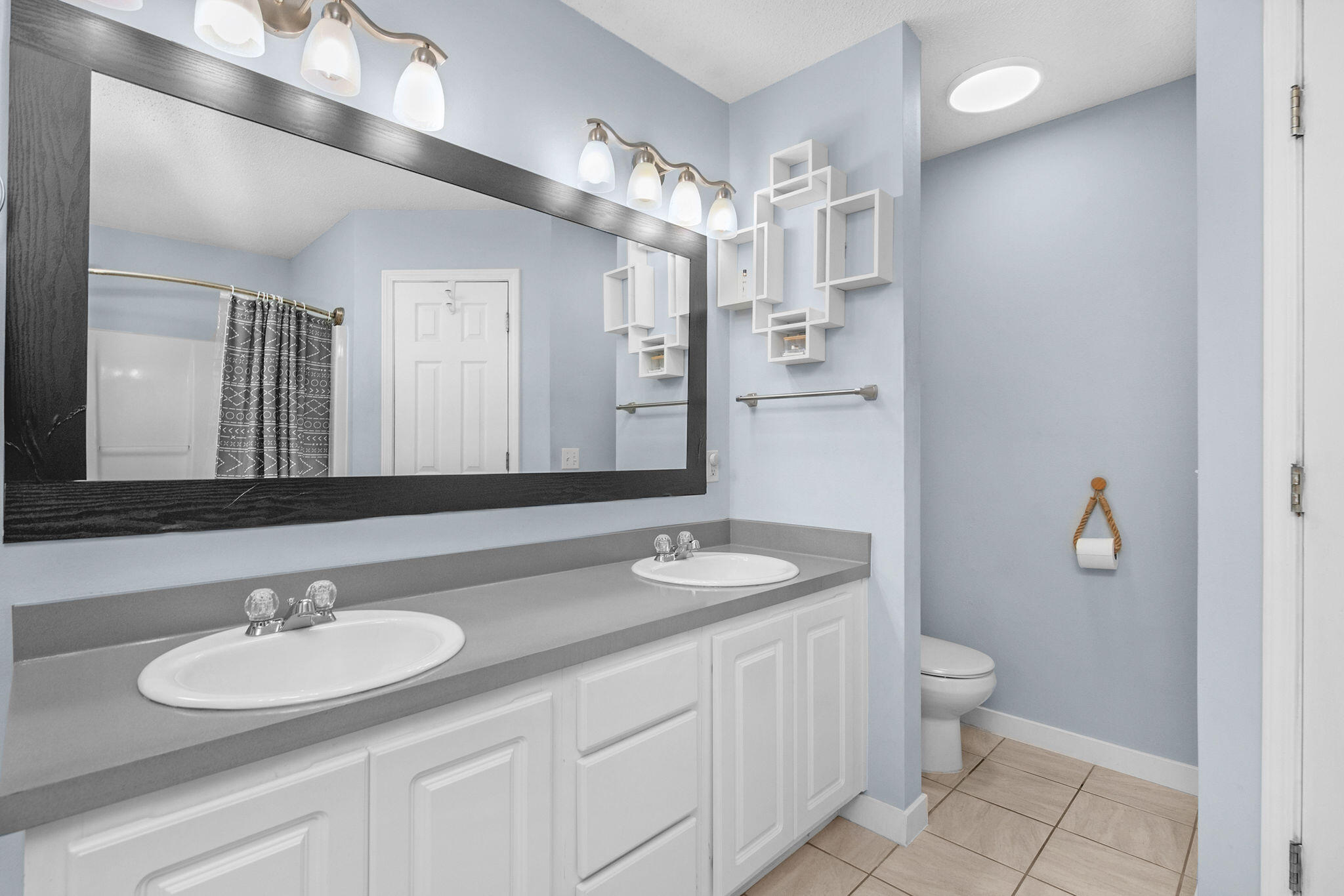 404 Bobby Drive Crestview, FL 32536 - Photo 26 of 30 a bathroom with a granite countertop sink and a mirror