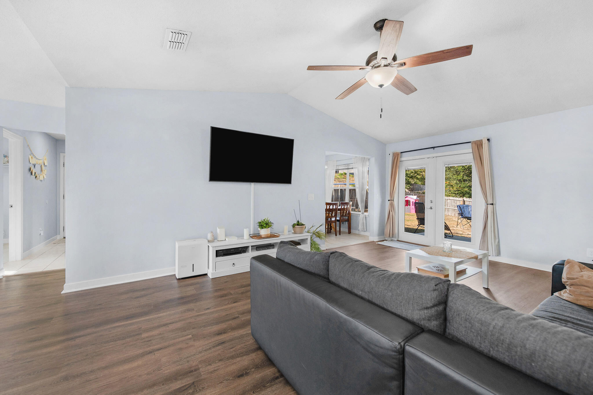 404 Bobby Drive Crestview, FL 32536 - Photo 5 of 30 a living room with furniture and a flat screen tv