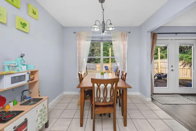 a view of a dining room with furniture window and outside view