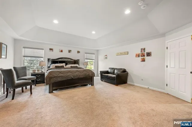 a view of walk in closet with clothes