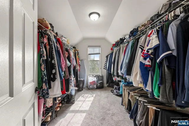 a bathroom with a tub sink and a mirror