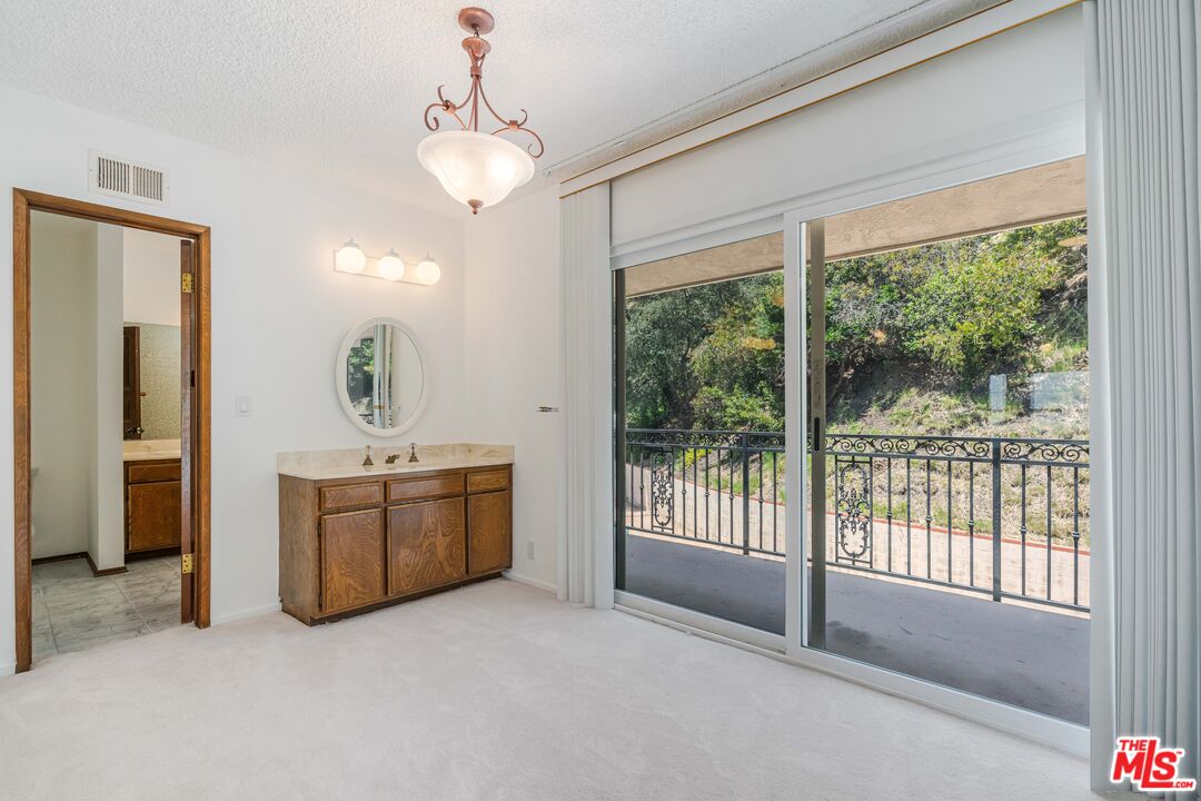 1181 Somera Road Los Angeles, CA 90077 - Photo 21 of 40 a view of livingroom with kitchen