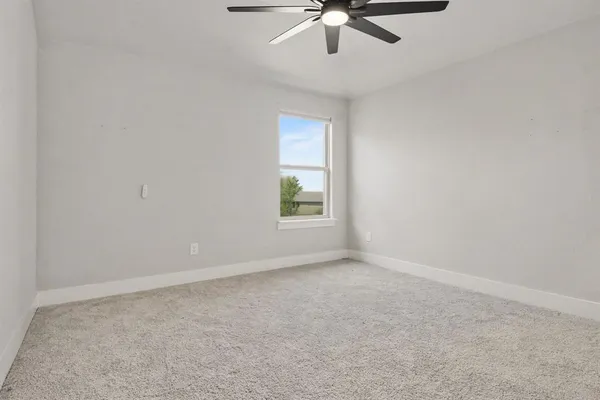 a view of a livingroom with workspace and a couch
