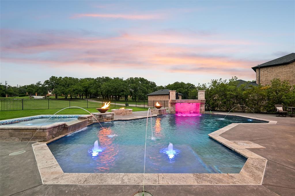 1657 Florence Road Keller, TX 76262 - Photo 33 of 40 a view of a swimming pool with a garden and trees