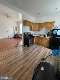 a kitchen with a stove and a refrigerator